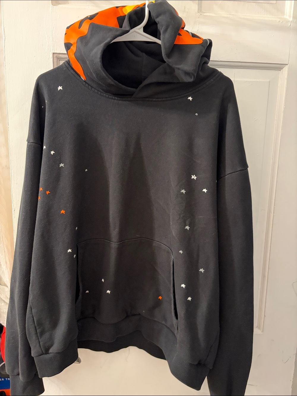 Black Hoodie with Orange Hood Lining and Star Prints